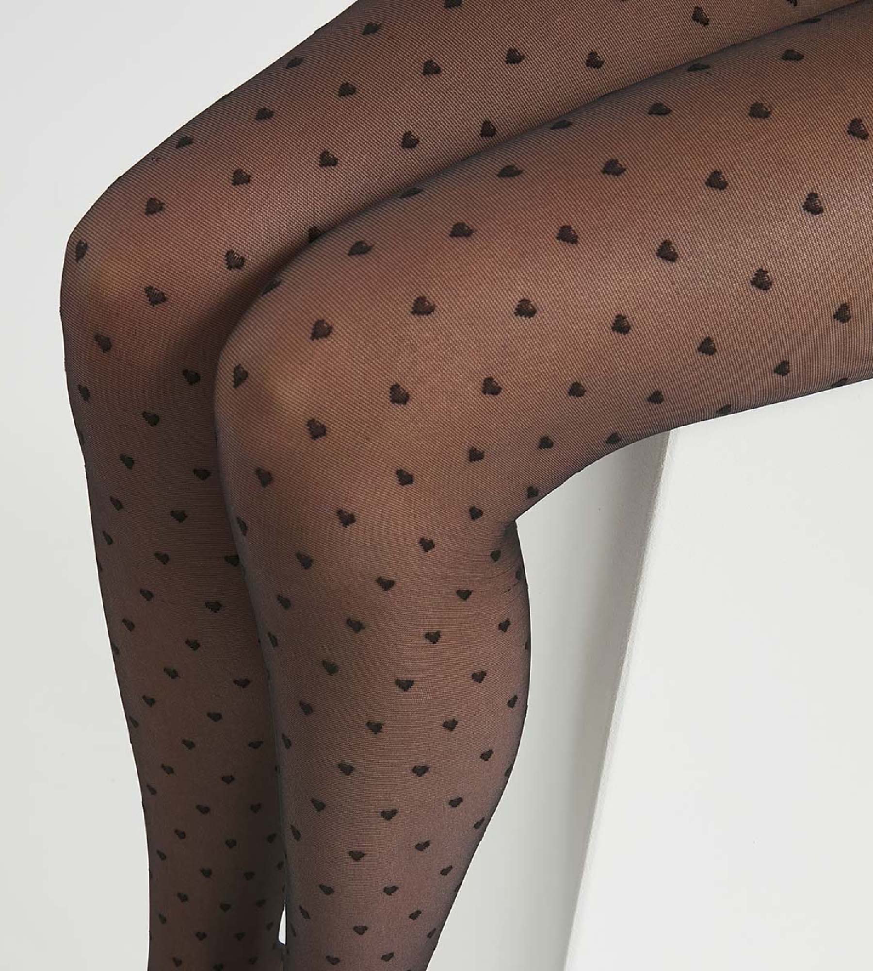 DIM Schwarze transparente Strumpfhose 20D mit Herzen - DIM Style