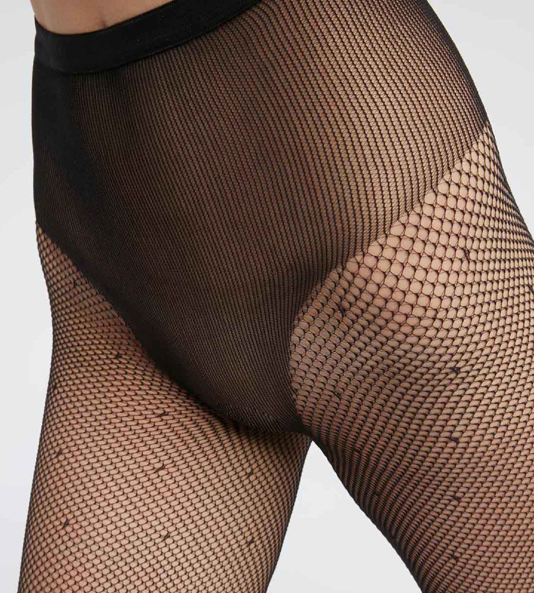 DIM Schwarze Netzstrumpfhose mit hohem Beinausschnitt und Pünktchen - DIM Style